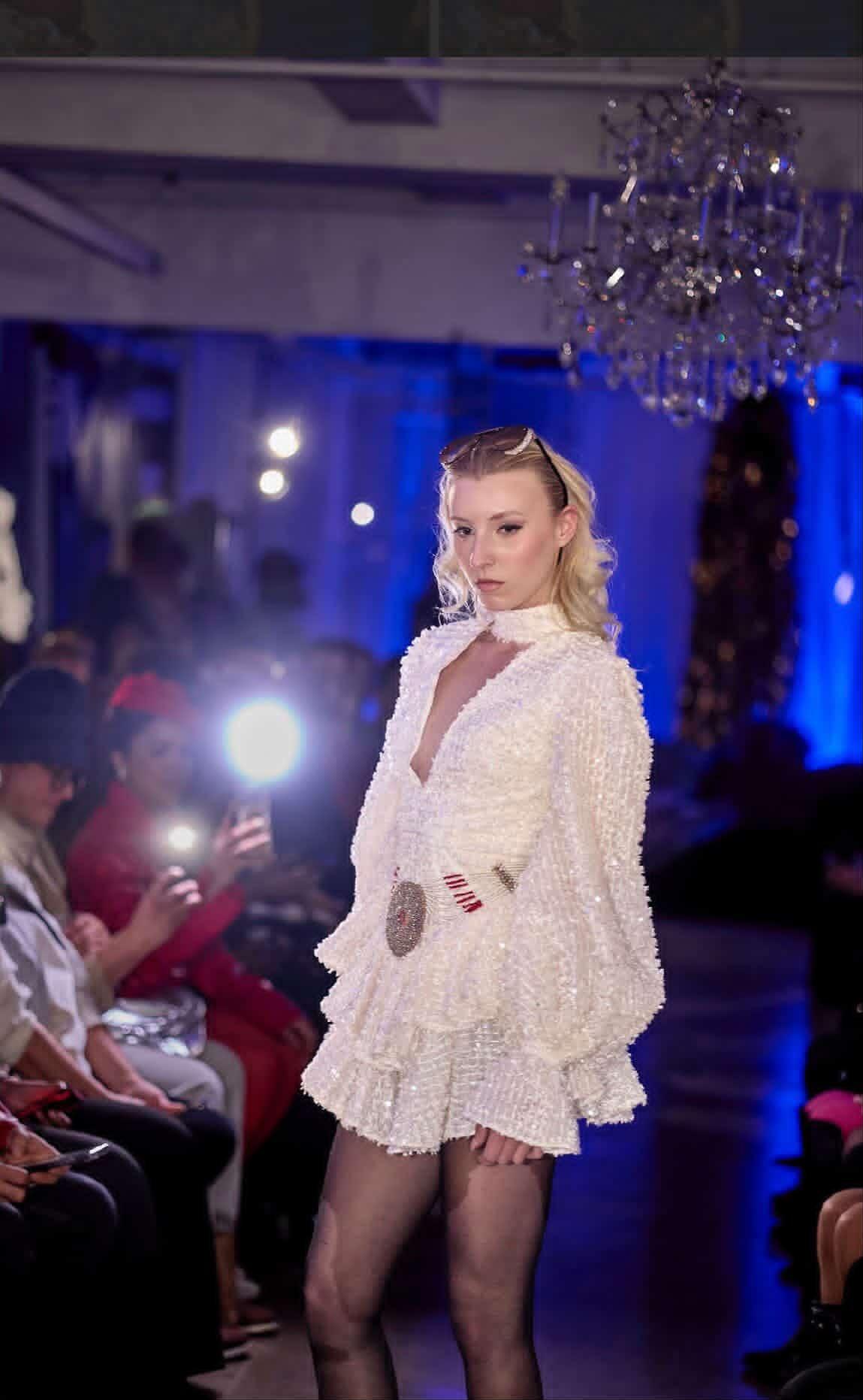Nina Samira close runway pose white dress high fashion model editorial lighting