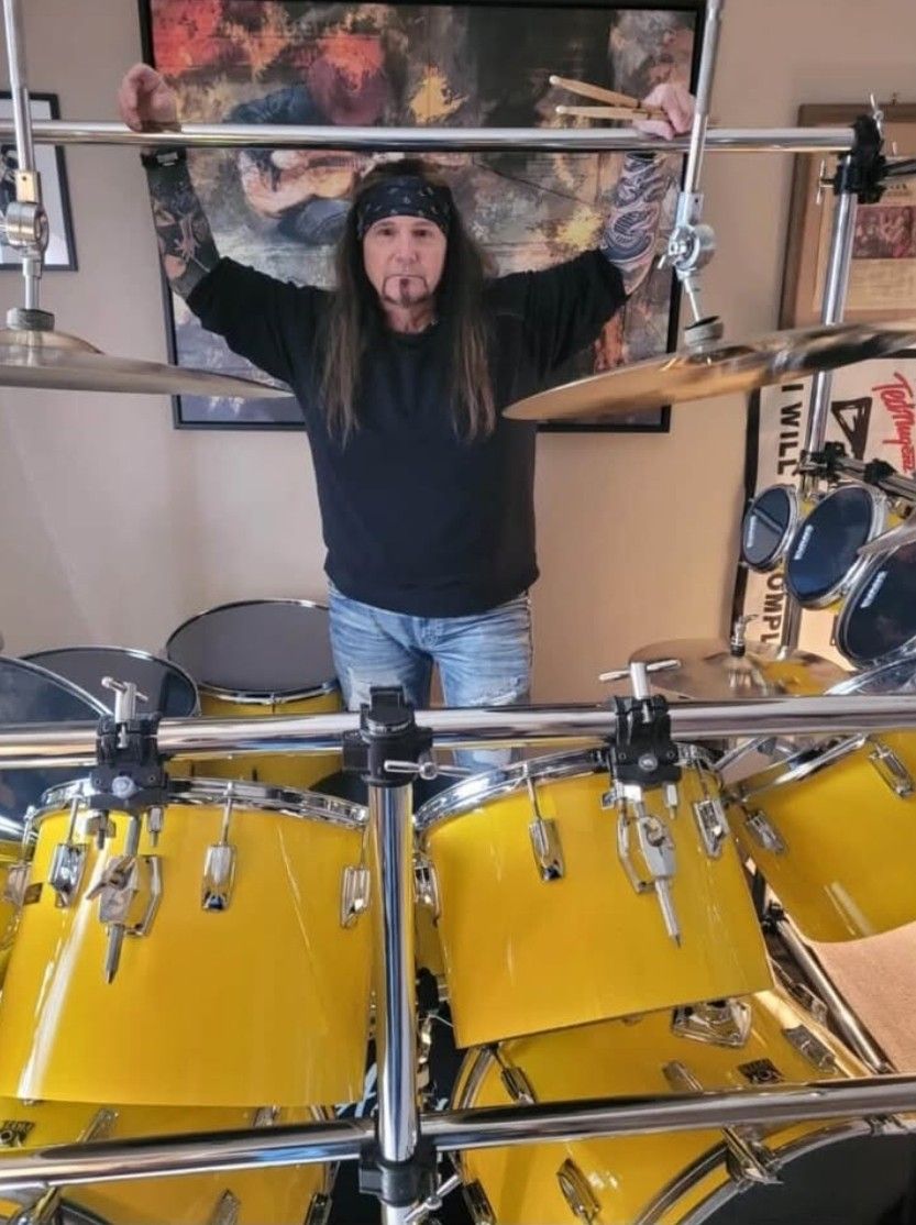 JJ Tyson drummer performing on yellow drum kit independent rock musician and music producer